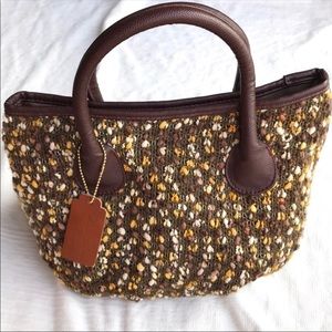 Arianna by Howard’s boucle top handle bag